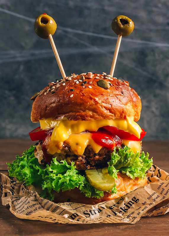 monster burger american cheese green olives seeded bun